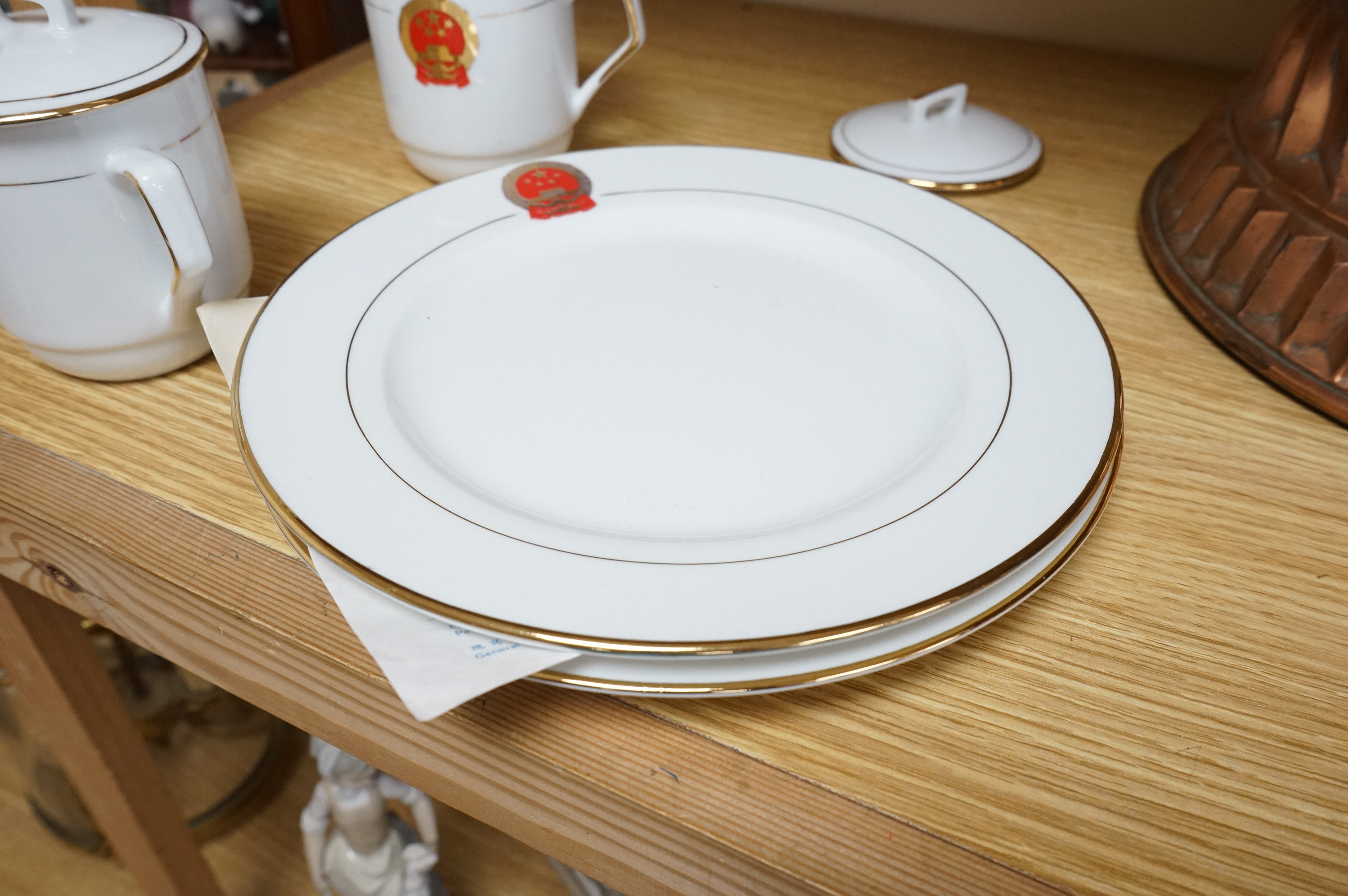 Chinese Communist Party canteen porcelain comprising two cups and two plates, largest 23cm in diameter. Condition - good